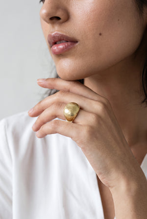 Gold oval metallic ring