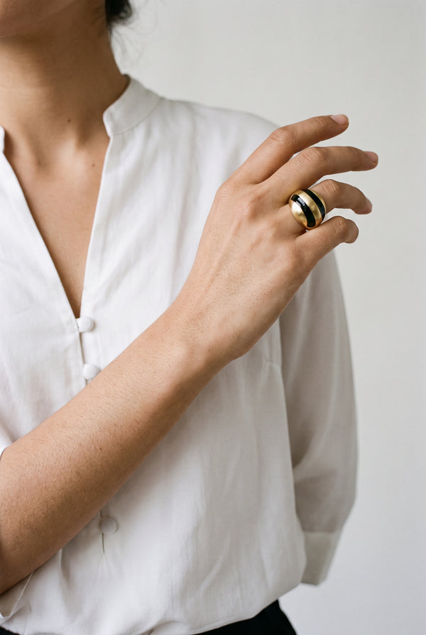 Gold Sculpted dome ring with black curved stripes