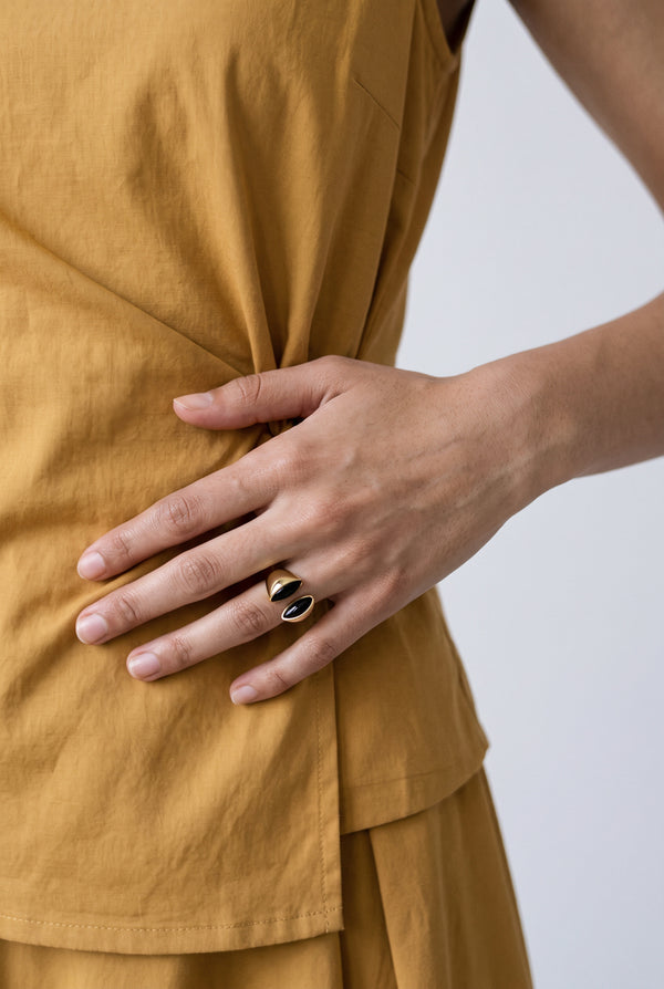 open-band ring featuring twin glossy obsidian-look accents