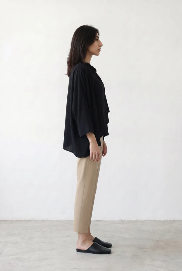 Asymmetric Layered Top