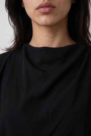 Asymmetric Layered Top