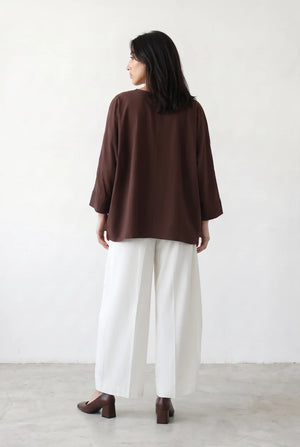 Asymmetric Layered Top