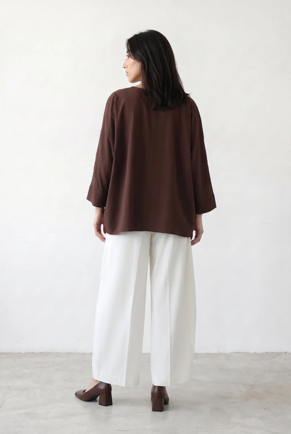 Asymmetric Layered Top
